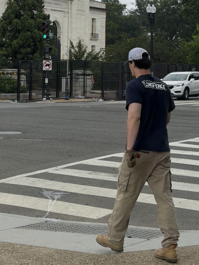 Worker crossing the street in Rawhide cargo pants
